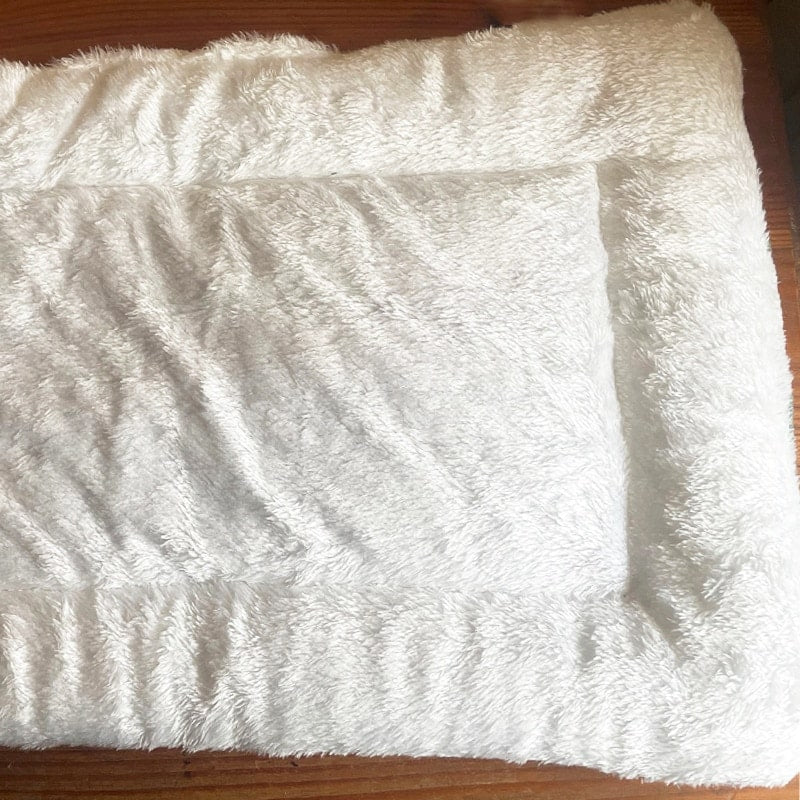 Dessous du tapis de couchage avec des motifs "moutons" pour animaux