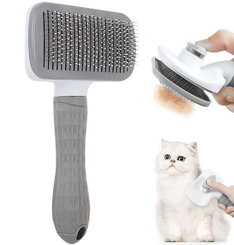 Brosse grise avec poussoir pour chien et chat